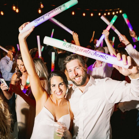 a man and a woman are holding up their arms