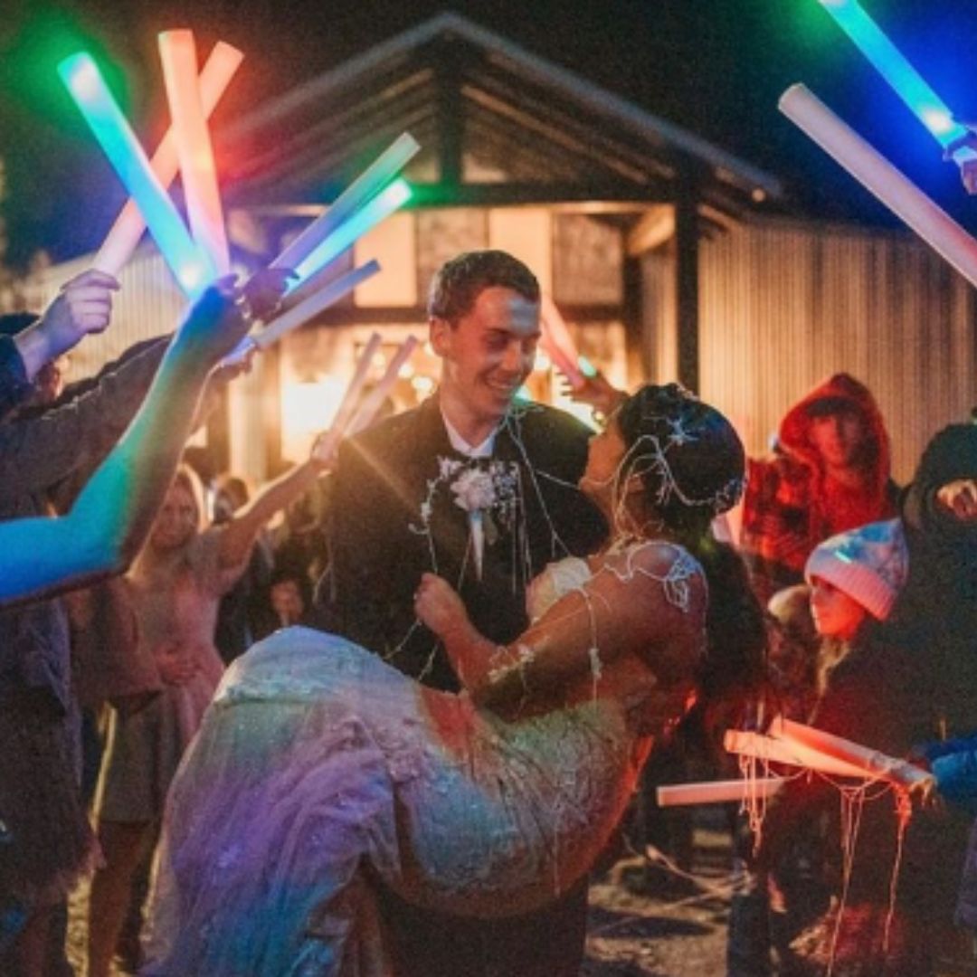 a group of people standing around each other at a party