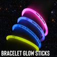 a stack of glowing bracelets with the words braclet glow sticks on them